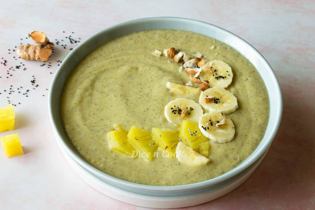 Fresh turmeric tropical smoothie bowl