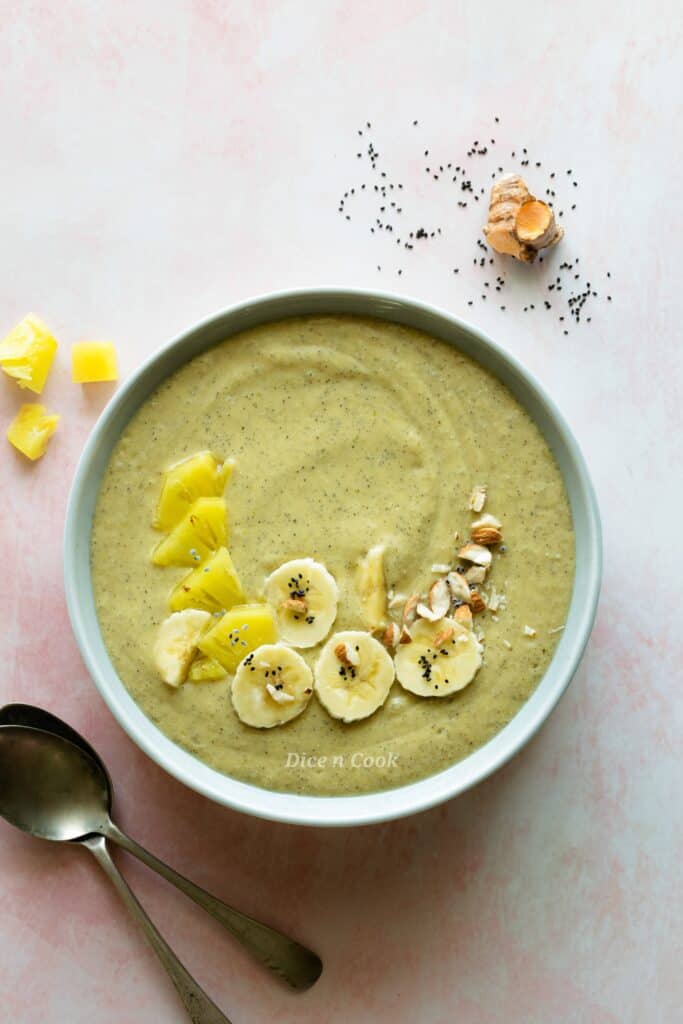 Fresh turmeric tropical smoothie bowl
